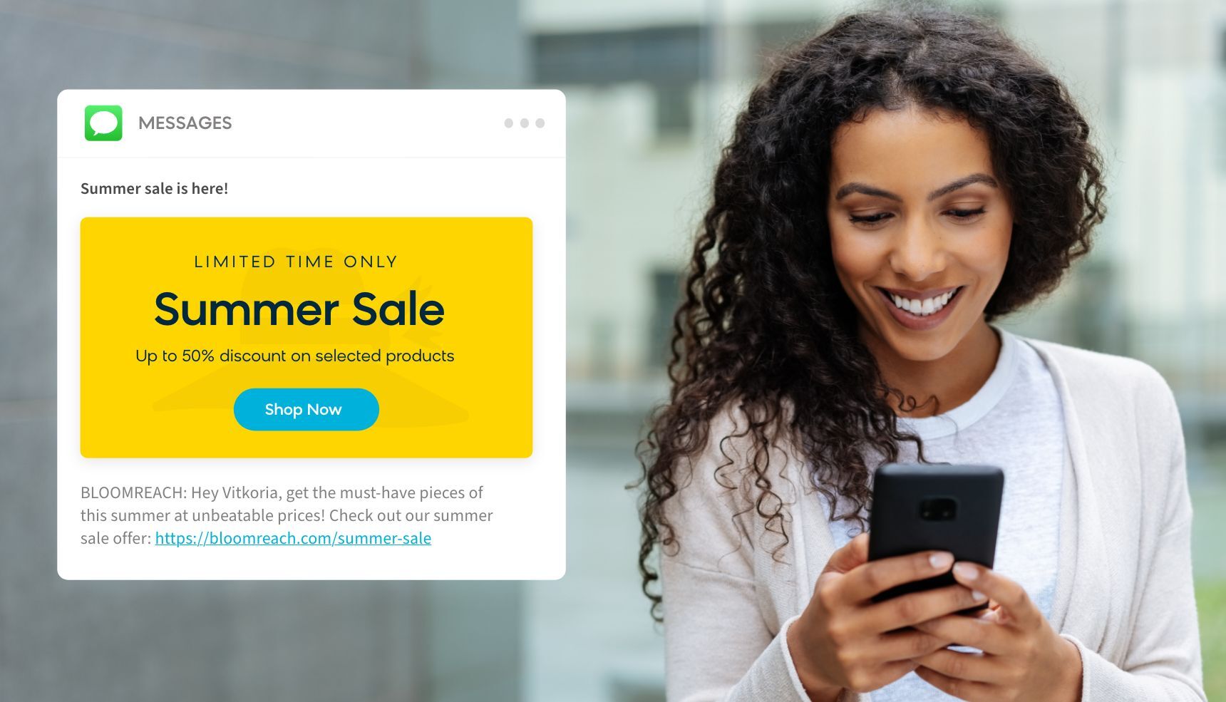 A customer receiving an MMs marketing message promoting a summer sale announcement