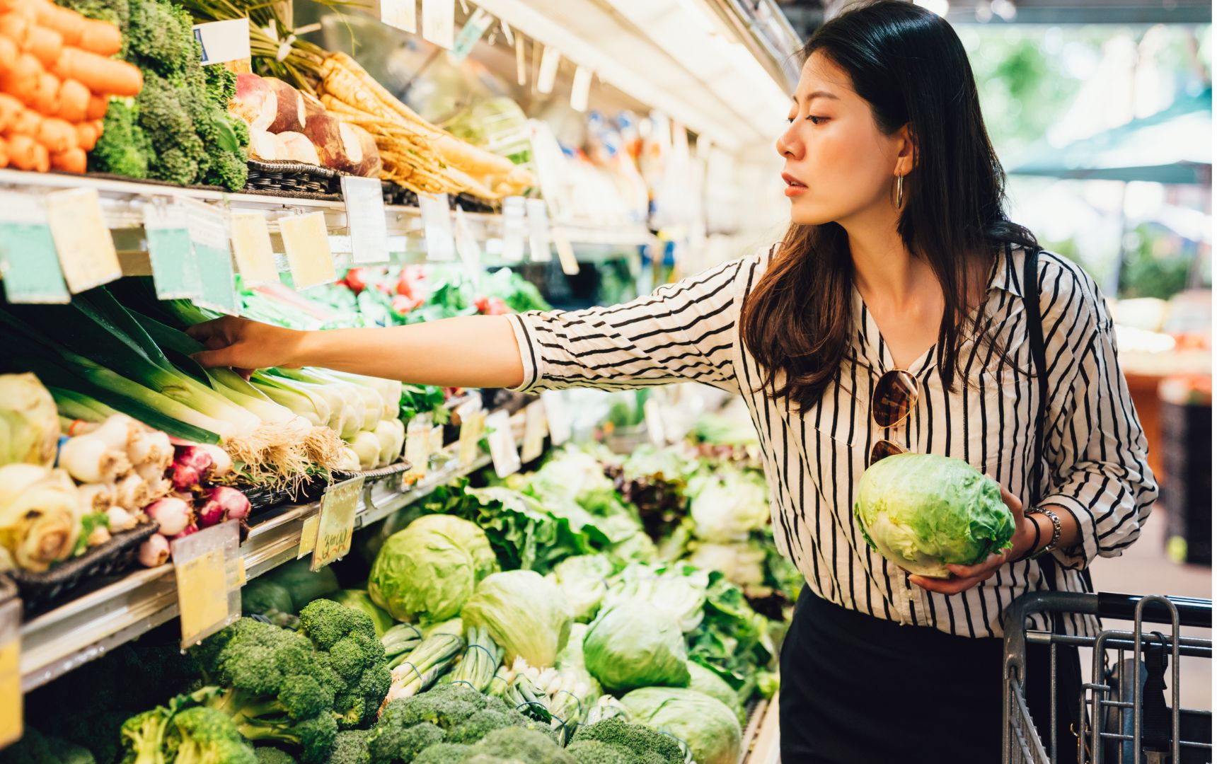 Woman Looking at Product While Grocery Shopping