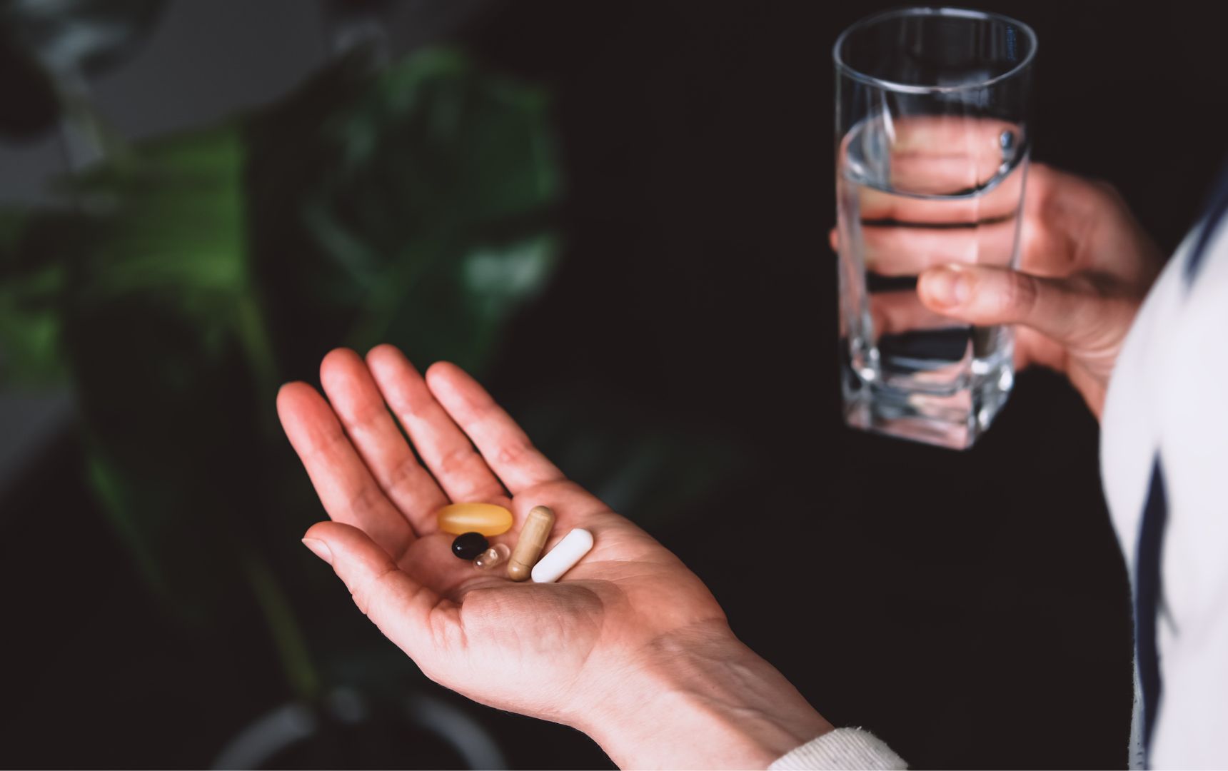 Woman Taking Vitamins and Supplements